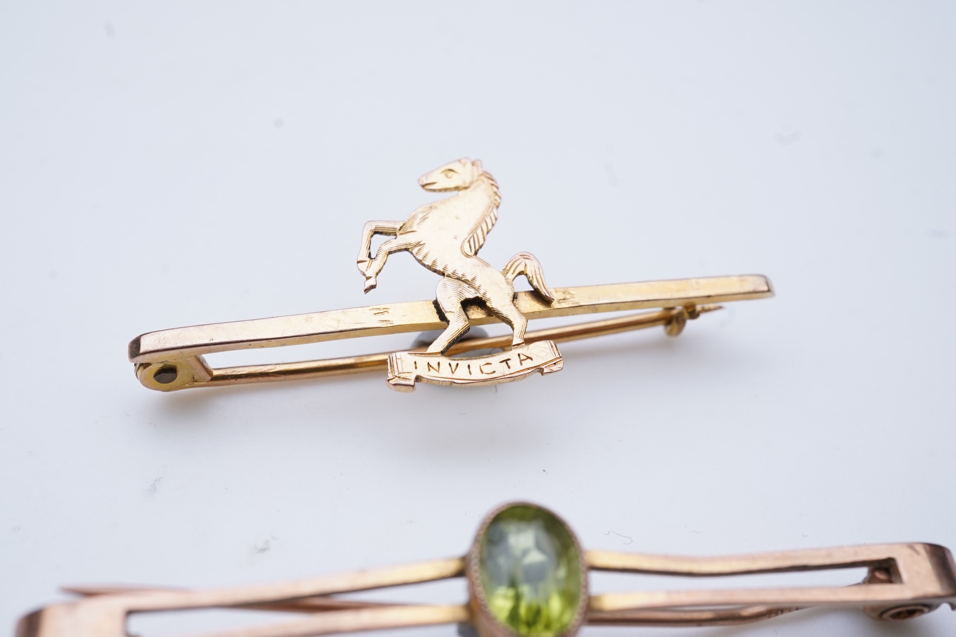Four brooches and a gold signet ring